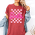 Trendy Barbie Logo T-Shirt with Checkered Background for Kids and Adults - Fun and Stylish Apparel for Barbie Fans - 1