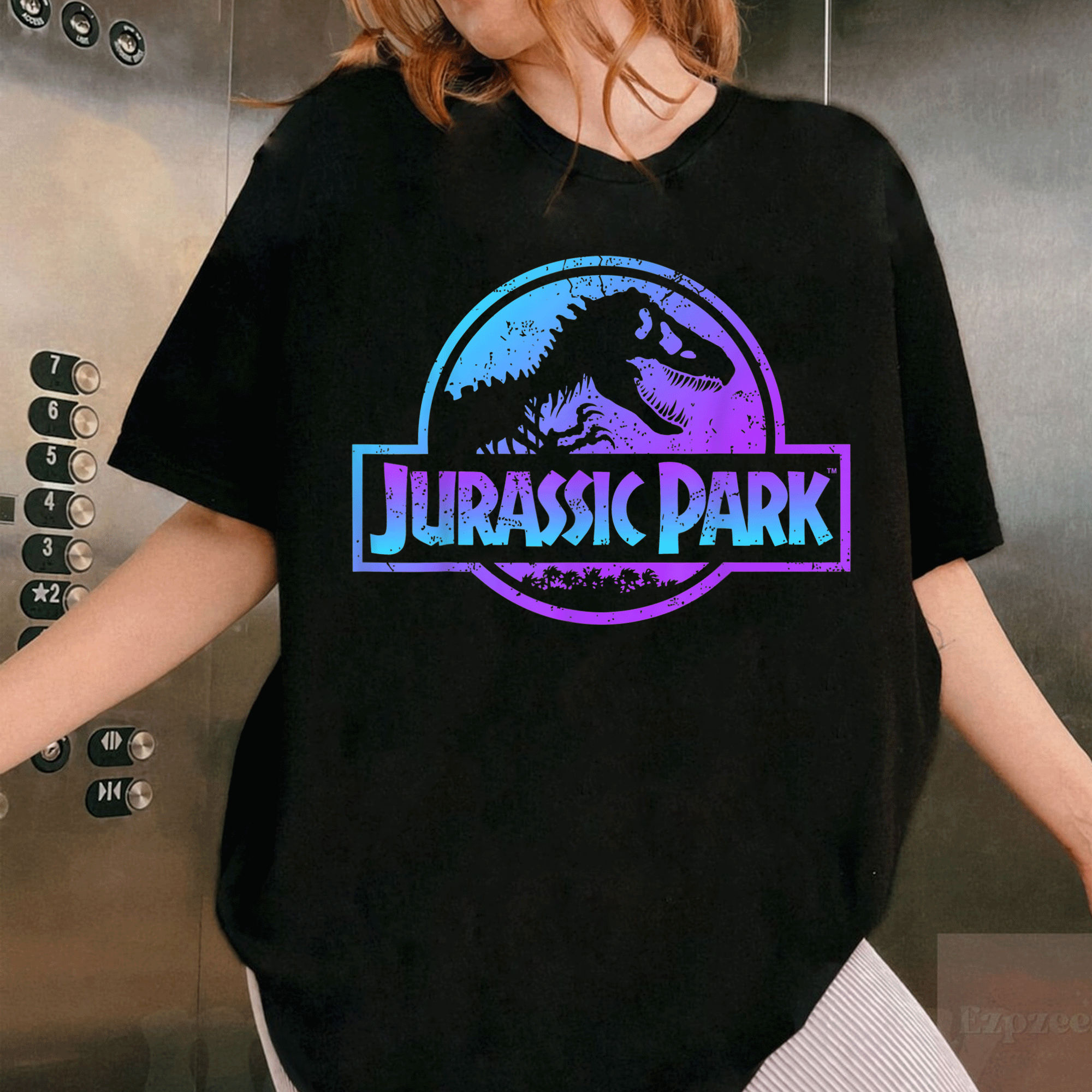 Jurassic Park Blue and Purple Fossil Logo Graphic T-Shirt for Dino Lovers - Trendy Vintage Style Tee for Fans - 1