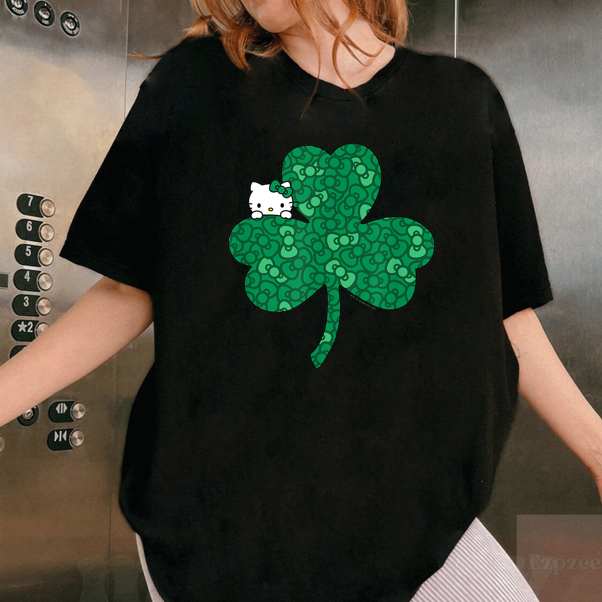 Adorable Hello Kitty Saint Patrick's Day T-Shirt with Clover and Bows Design Perfect for Celebrating in Style - 1