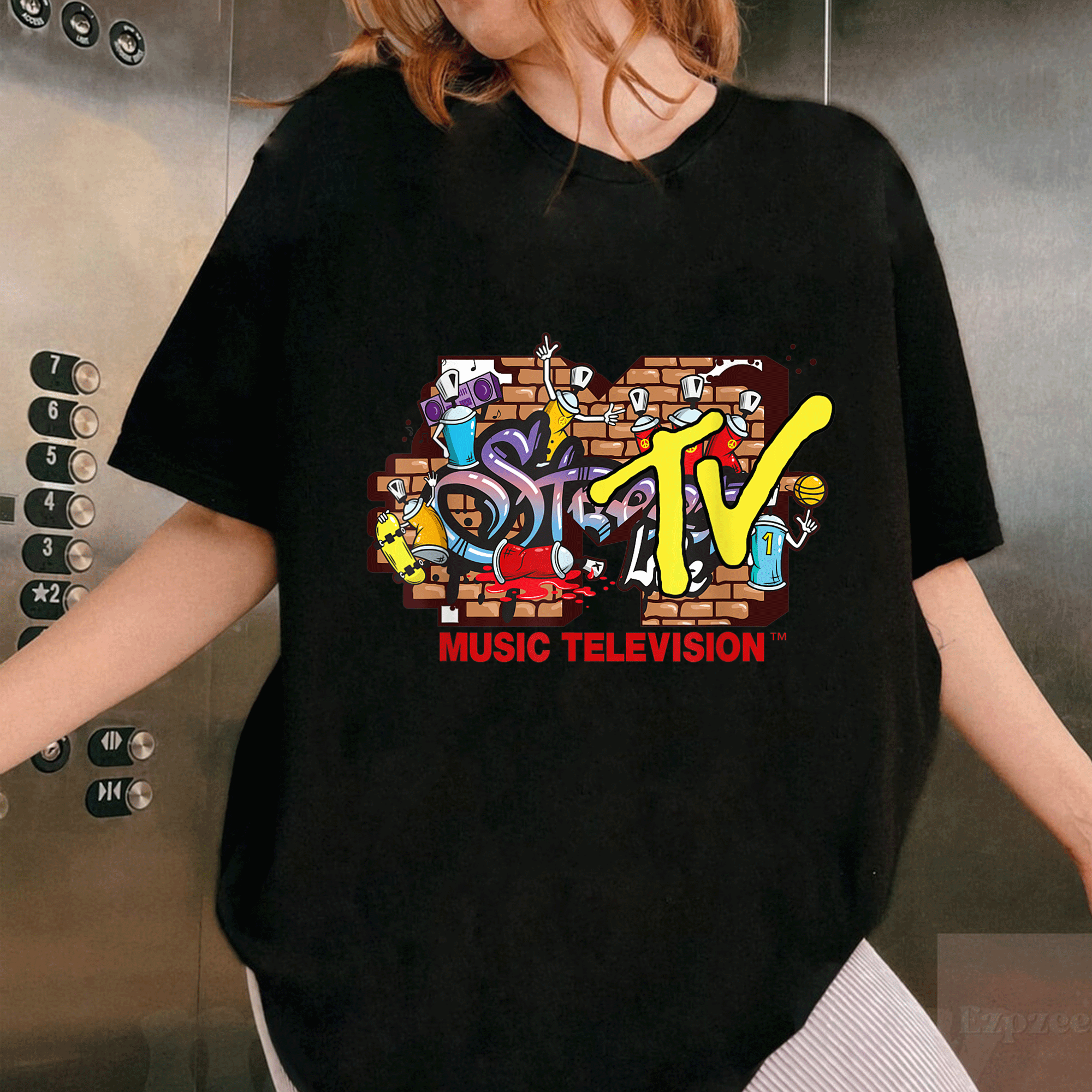 Mademark x MTV Streetwear T-Shirt Featuring Iconic MTV Logo with Graffiti Wall Design, Stylish Urban Fashion for Fans - 1